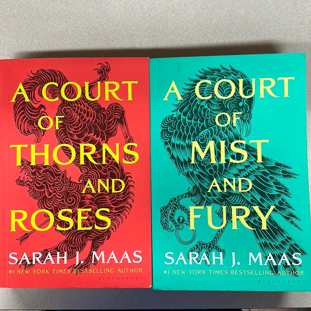 A court of thorns and roses and a court of mist and fury.  Soft cover